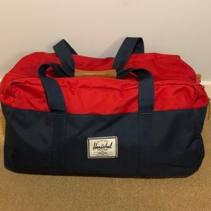 Herschel • Blue and Red Duffel Bag